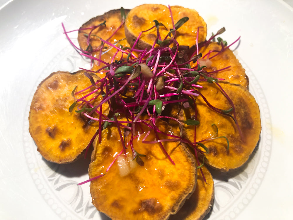 beet microgreens on sweet potatoes